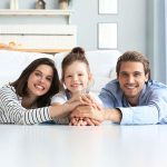 happy parents and young daughter