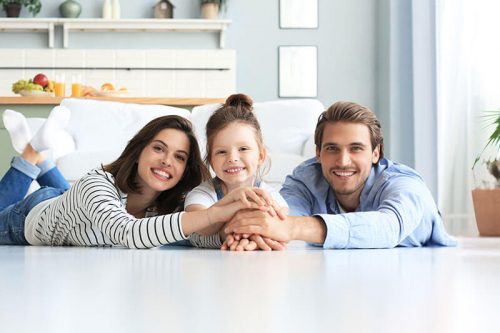 happy parents and young daughter