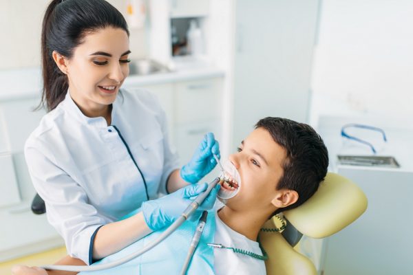 young boy getting his teeth treated